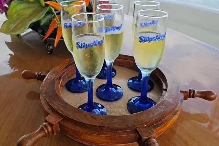 Slide: The Image of Champagne glasses on a wooden tray aboard a 2004 Lazzara SC Motor Yacht. - 8
