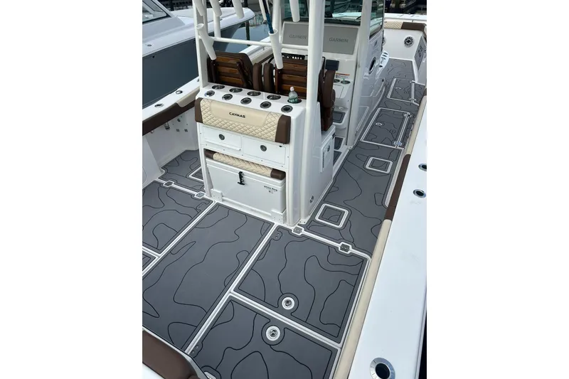 Slide: The Image of 2024 Caymas 34 CT boat interior with sleek, modern design and advanced Garmin equipment. - 6