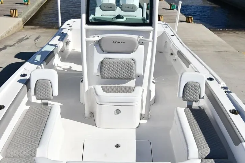 Slide: The Image of 2024 Caymas 281 HB boat interior with gray quilted seating and sleek design. - 11