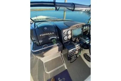 Slide: The Image of 2018 Formula 350 Crossover Bowrider dashboard with navigation controls and gauges. - 13