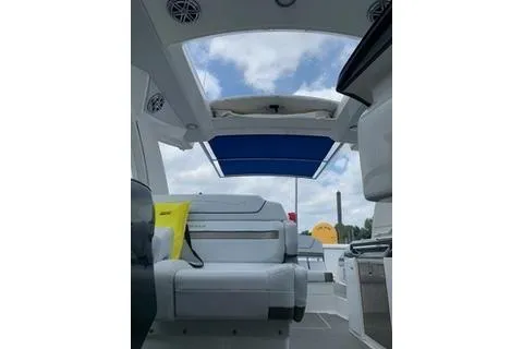 Slide: The Image of 2018 Formula 350 Crossover Bowrider interior with open sunroof and seating. - 20