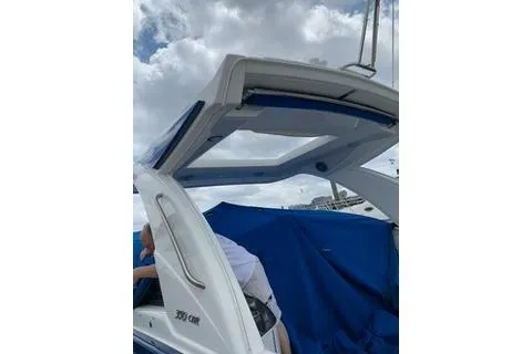 Slide: The Image of 2018 Formula 350 Crossover Bowrider with open canopy under cloudy sky. - 24