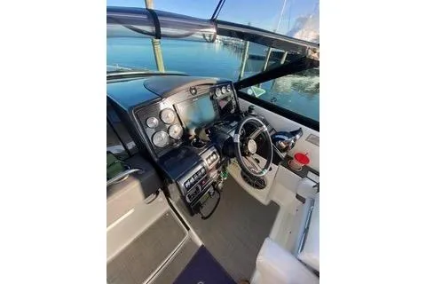 Slide: The Image of 2018 Formula 350 Crossover Bowrider cockpit with modern controls and steering wheel. - 25