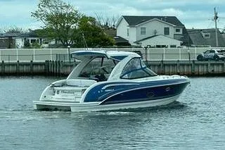 Slide: The Image of 2018 Formula 350 Crossover Bowrider cruising on a calm waterway near residential area. - 4