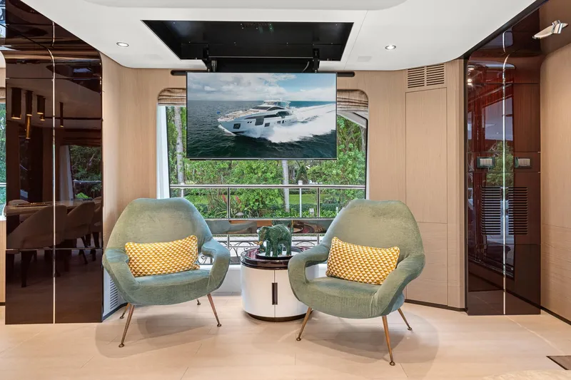 Slide: The Image of Luxurious Azimut Grande 27 METRI yacht interior with modern seating and TV, 2022 model. - 100