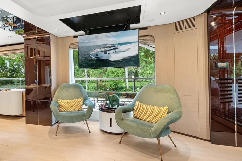 Slide: The Image of Luxurious Azimut Grande 27 METRI 2022 yacht interior with modern seating and large TV display. - 101