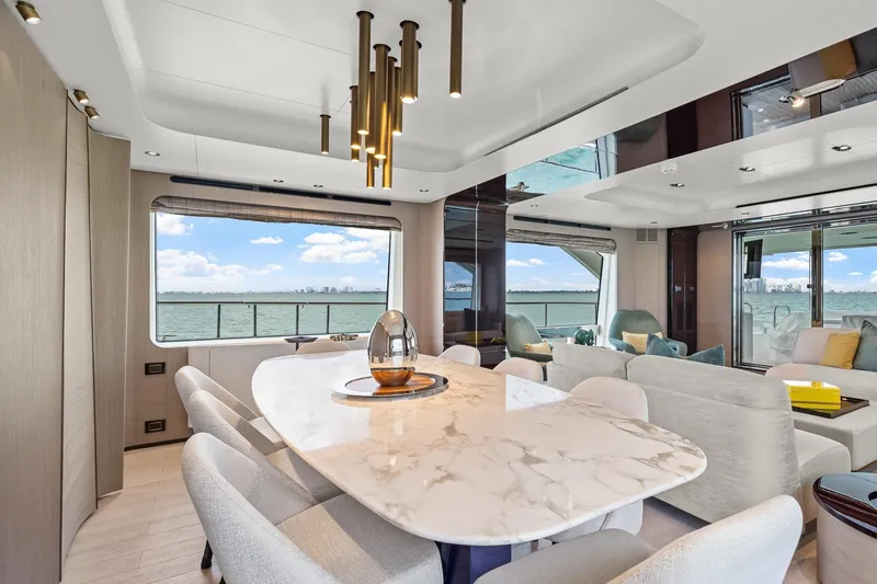 Slide: The Image of Luxurious interior of 2022 Azimut Grande 27 METRI yacht with elegant dining area and sea view. - 103