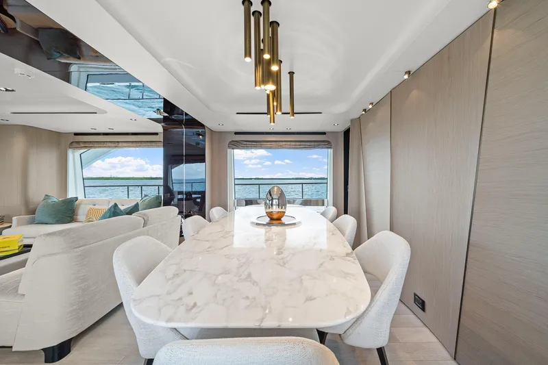 Slide: The Image of Luxurious dining area on 2022 Azimut Grande 27 METRI yacht with elegant marble table. - 114