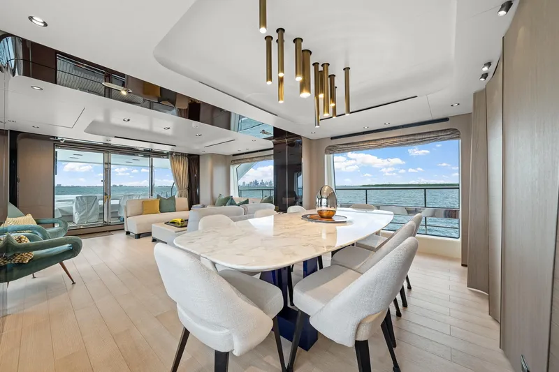 Slide: The Image of Luxurious interior of 2022 Azimut Grande 27 METRI yacht with elegant dining area and sea view. - 115