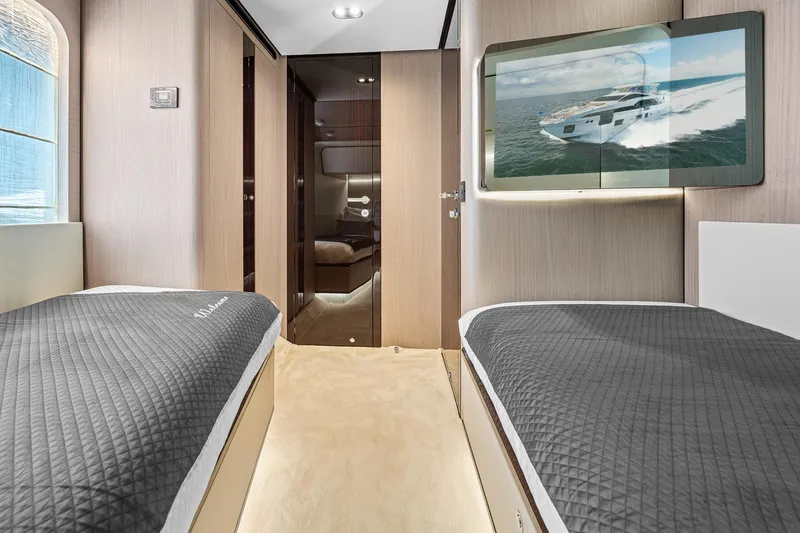 Slide: The Image of Luxurious interior of 2022 Azimut Grande 27 METRI yacht with twin beds and modern decor. - 123