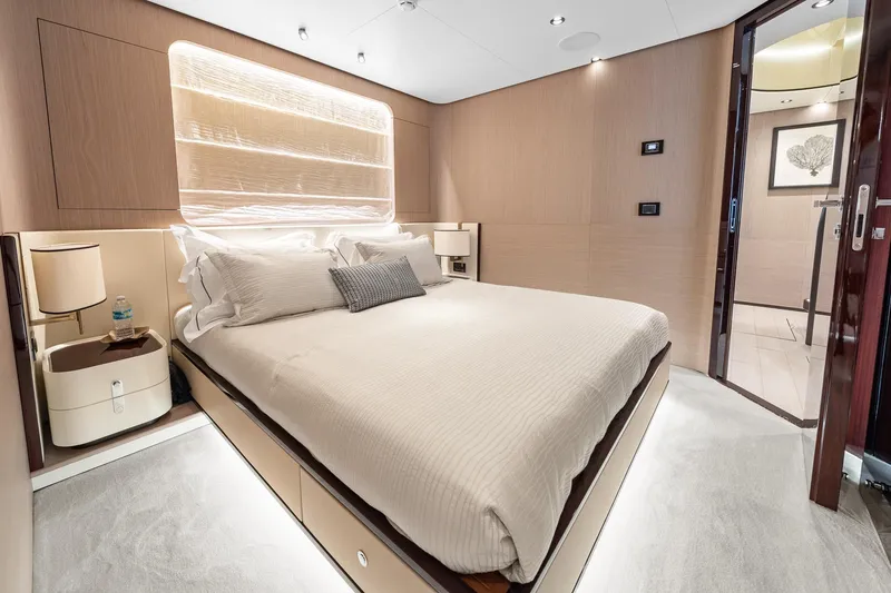 Slide: The Image of Luxurious bedroom interior of 2022 Azimut Grande 27 METRI yacht, featuring elegant design and modern amenities. - 129