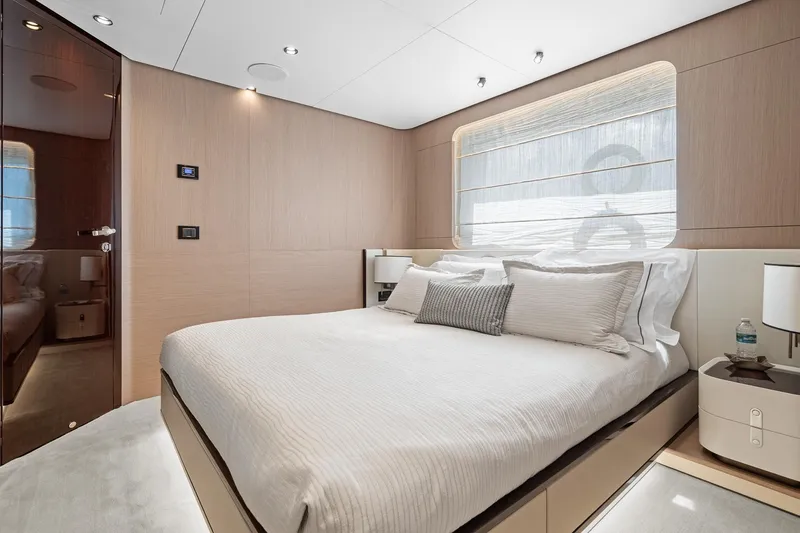 Slide: The Image of Luxurious bedroom interior of 2022 Azimut Grande 27 METRI yacht, featuring elegant design and modern amenities. - 132