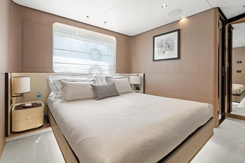 Slide: The Image of Luxurious bedroom interior of 2022 Azimut Grande 27 METRI yacht, featuring elegant design and modern amenities. - 134