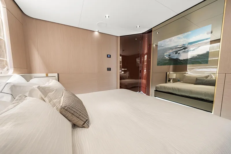 Slide: The Image of Luxurious bedroom interior of 2022 Azimut Grande 27 METRI yacht, featuring elegant design and comfort. - 137