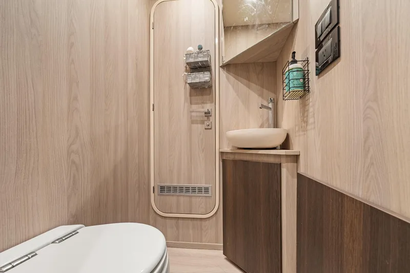 Slide: The Image of Luxurious bathroom interior of 2022 Azimut Grande 27 METRI yacht, featuring modern fixtures. - 139