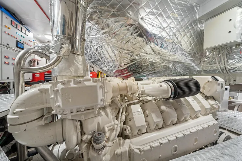 Slide: The Image of Engine room of 2022 Azimut Grande 27 METRI yacht, featuring advanced machinery and controls. - 148