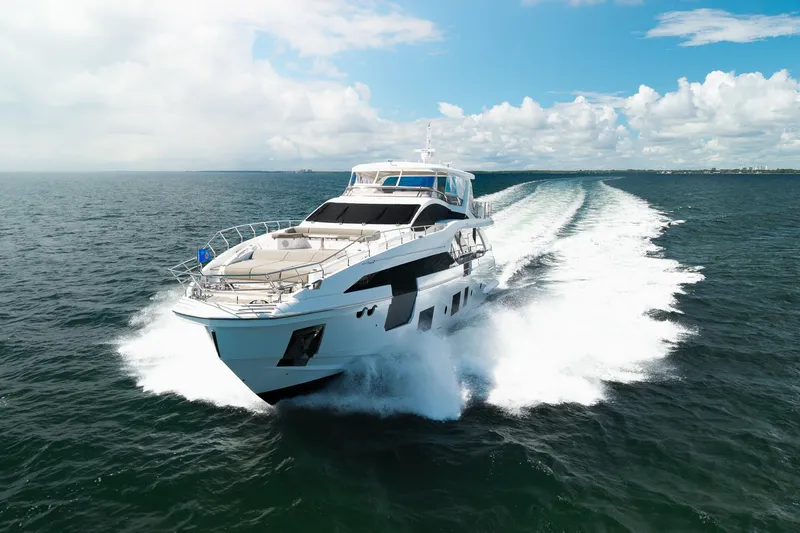 Slide: The Image of Azimut Grande 27 METRI 2022 yacht cruising on open sea under clear skies. - 15