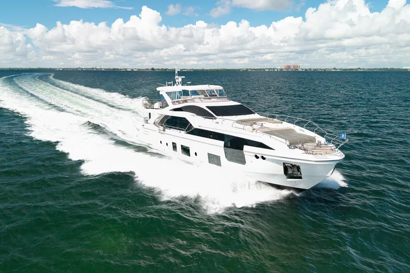 Slide: The Image of Luxurious 2022 Azimut Grande 27 METRI yacht cruising on open sea under blue sky. - 17