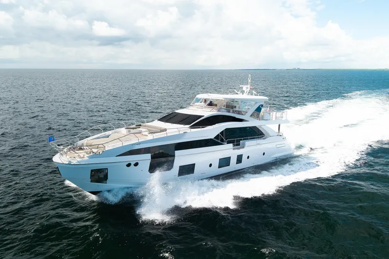 Slide: The Image of Luxury yacht Azimut Grande 27 METRI 2022 cruising on open sea under clear skies. - 23