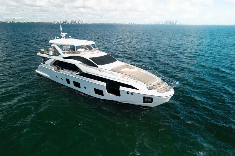 Slide: The Image of Luxurious 2022 Azimut Grande 27 METRI yacht cruising on open water. - 27