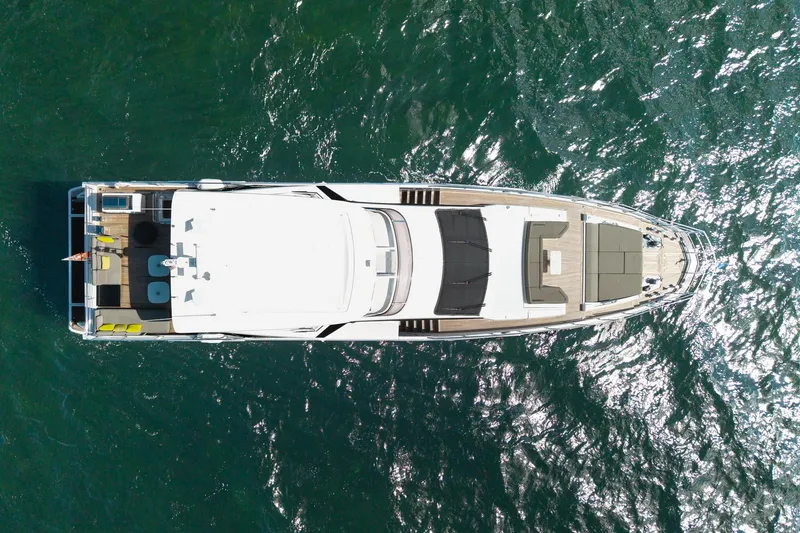 Slide: The Image of Aerial view of 2022 Azimut Grande 27 METRI yacht on shimmering water. - 28