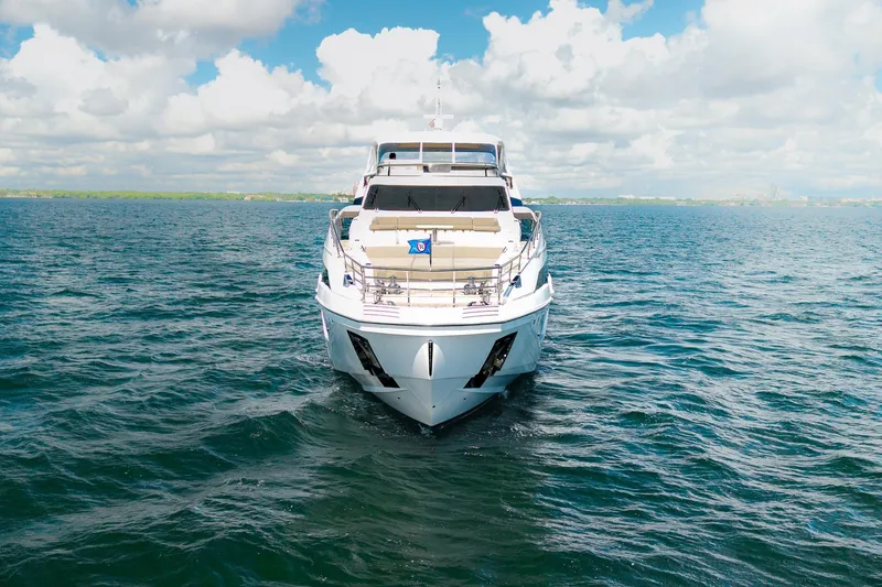 Slide: The Image of 2022 Azimut Grande 27 METRI yacht on open water under a cloudy sky. - 35