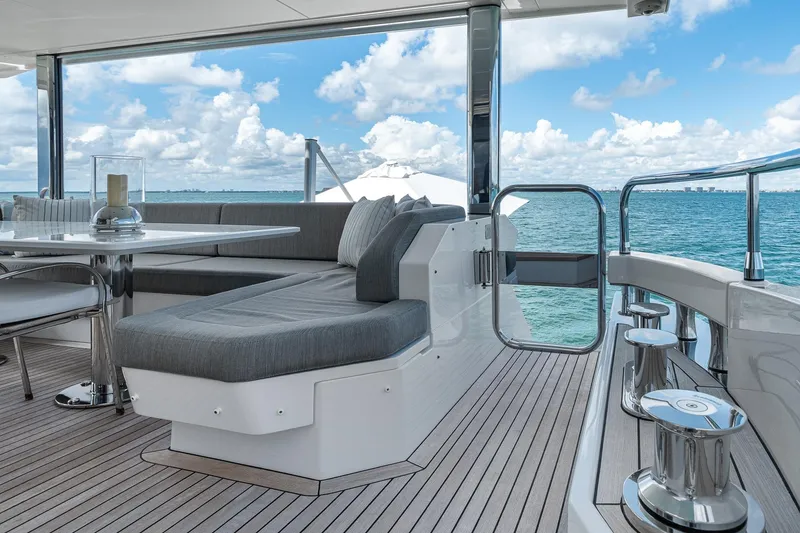 Slide: The Image of Luxurious Azimut Grande 27 METRI yacht deck with elegant seating, ocean view, and modern design. - 36