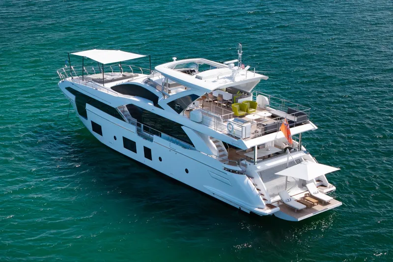 Slide: The Image of Luxury Azimut Grande 27 METRI yacht, 2022 model, cruising on clear blue waters. - 4