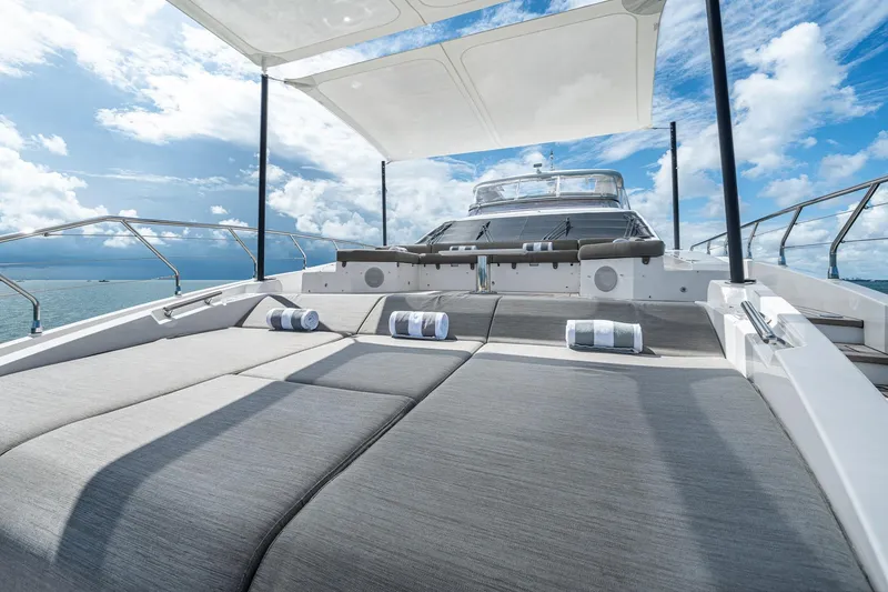 Slide: The Image of Luxurious Azimut Grande 27 METRI yacht deck with sun loungers, 2022 model. - 43