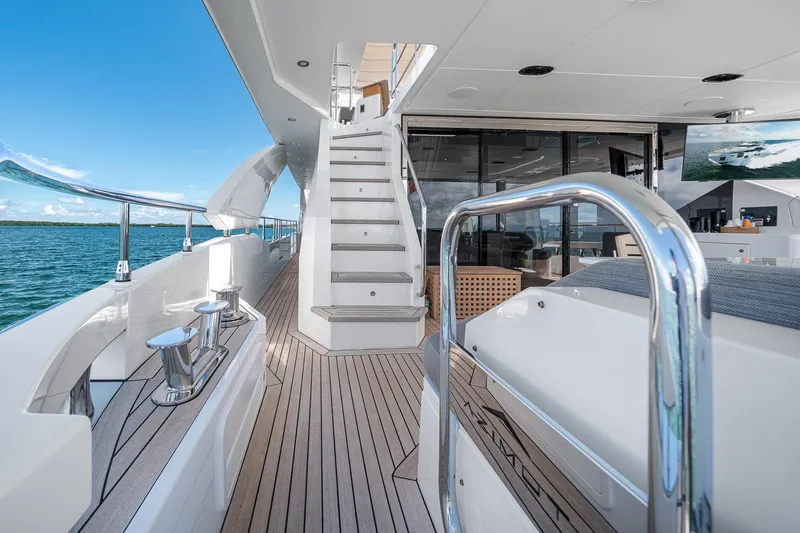 Slide: The Image of Luxurious 2022 Azimut Grande 27 METRI yacht deck with sleek design and ocean view. - 49