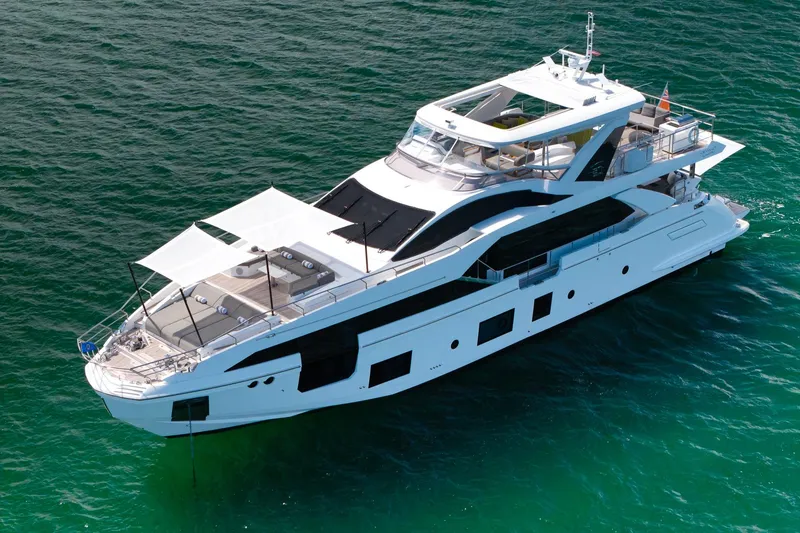 Slide: The Image of Azimut Grande 27 METRI 2022 luxury yacht on clear blue water. - 5