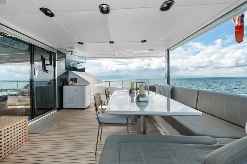 Slide: The Image of Luxurious 2022 Azimut Grande 27 METRI yacht deck with elegant seating and ocean view. - 52