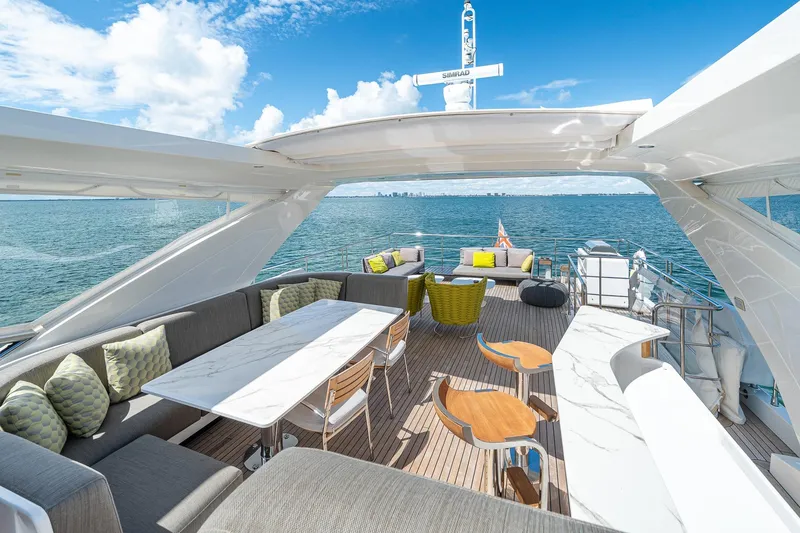 Slide: The Image of Luxurious 2022 Azimut Grande 27 METRI yacht deck with elegant seating and ocean view. - 56