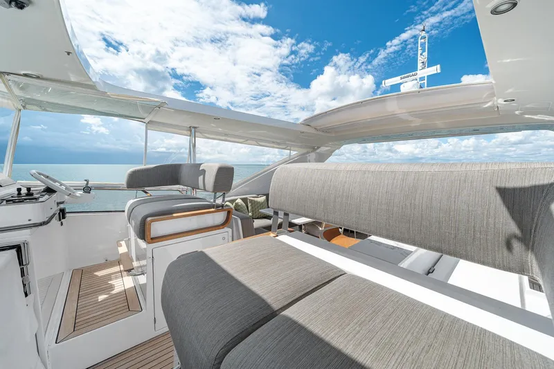 Slide: The Image of Luxurious 2022 Azimut Grande 27 METRI yacht interior with ocean view and modern seating. - 57