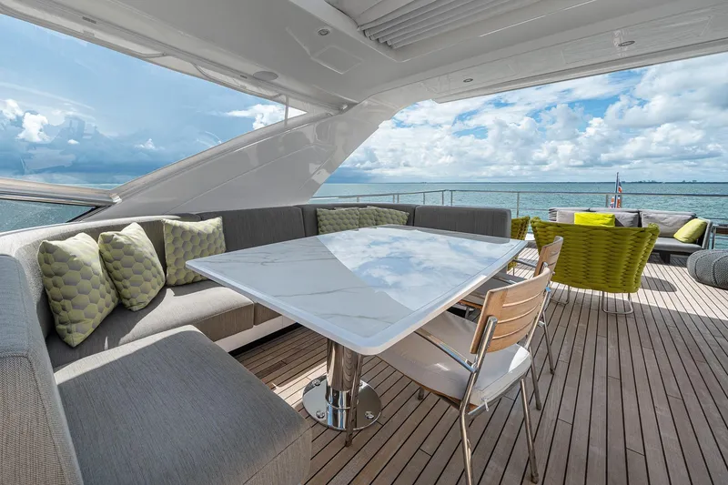 Slide: The Image of Luxurious deck of 2022 Azimut Grande 27 METRI yacht with elegant seating and ocean view. - 59
