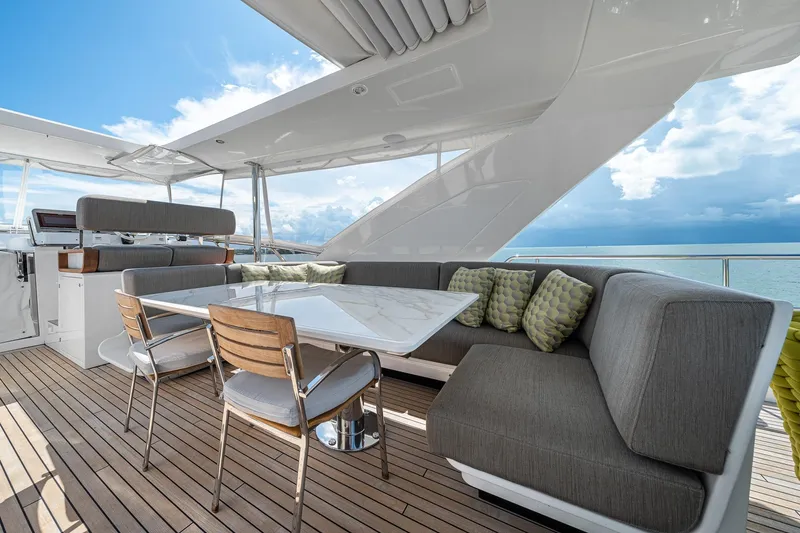 Slide: The Image of Luxurious 2022 Azimut Grande 27 METRI yacht deck with elegant seating and ocean view. - 62