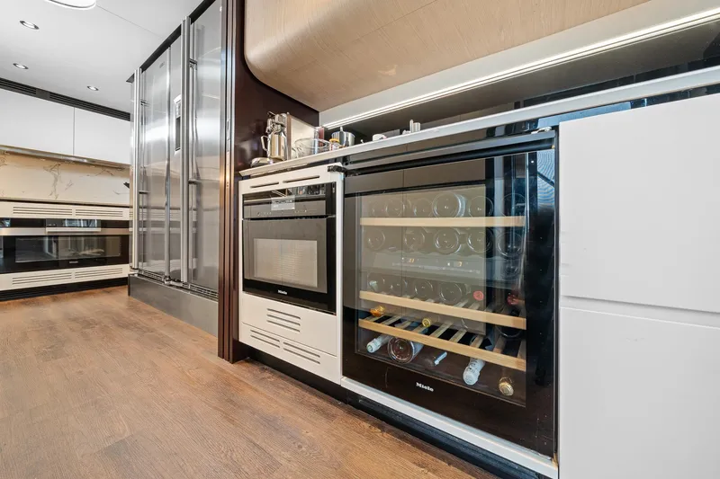 Slide: The Image of Modern kitchen in 2022 Azimut Grande 27 METRI yacht with wine cooler and stainless appliances. - 68