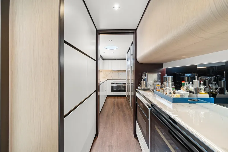 Slide: The Image of Luxurious kitchen interior of 2022 Azimut Grande 27 METRI yacht, featuring modern appliances. - 72