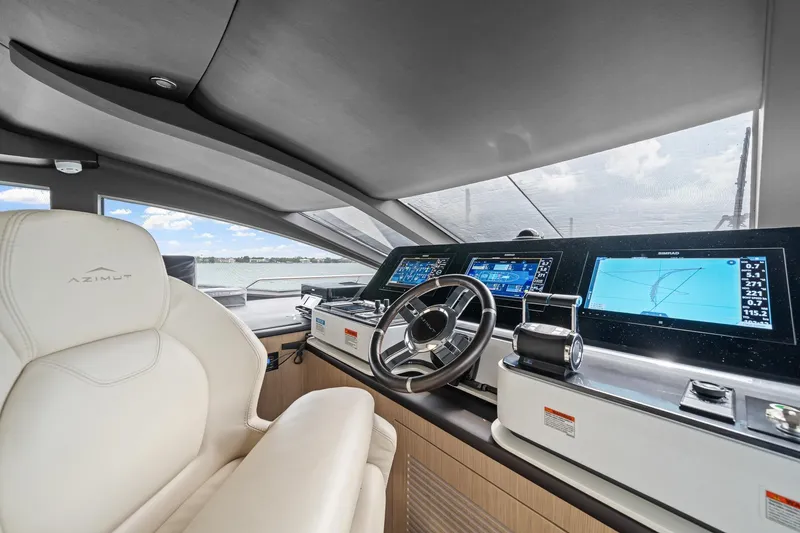 Slide: The Image of Luxurious helm of 2022 Azimut Grande 27 METRI yacht with advanced navigation displays. - 74