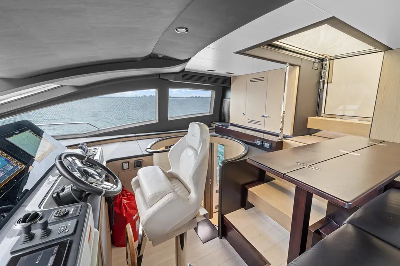 Slide: The Image of Luxurious interior of 2022 Azimut Grande 27 METRI yacht with modern helm and seating. - 77