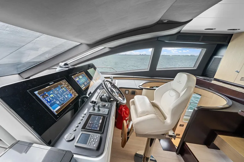 Slide: The Image of Luxurious helm of 2022 Azimut Grande 27 METRI yacht with advanced navigation controls. - 78