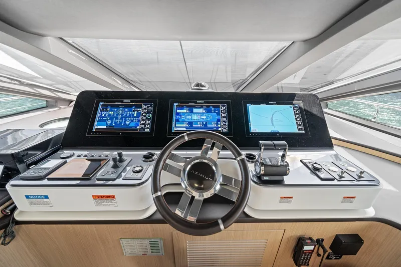 Slide: The Image of Cockpit of 2022 Azimut Grande 27 METRI yacht with advanced navigation displays. - 80