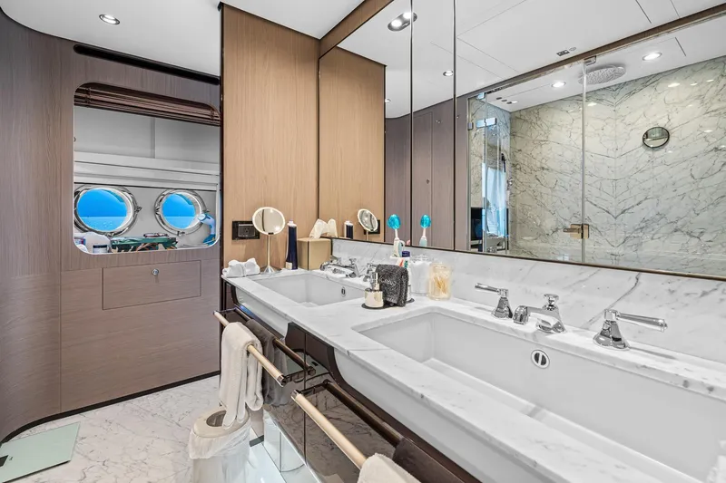 Slide: The Image of Luxurious bathroom in 2022 Azimut Grande 27 METRI yacht with marble finishes and dual sinks. - 96