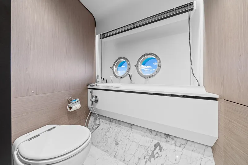 Slide: The Image of Luxurious bathroom on 2022 Azimut Grande 27 METRI yacht with porthole views. - 98