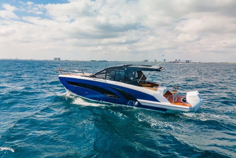 The Image of 2024 Hanover 387 boat cruising on open sea under cloudy sky. - 0