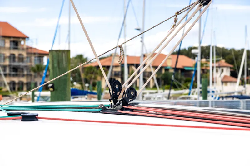 Slide: The Image of Rope rigging on a 2018 Lagoon 40 catamaran in a marina setting. - 24