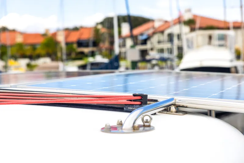 Slide: The Image of Solar panels on 2018 Lagoon 40 catamaran with red ropes, marina background. - 25