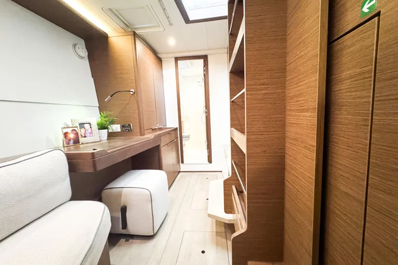 Slide: The Image of Luxurious interior of 2018 Lagoon 40 yacht with modern wood finish and cozy seating. - 38