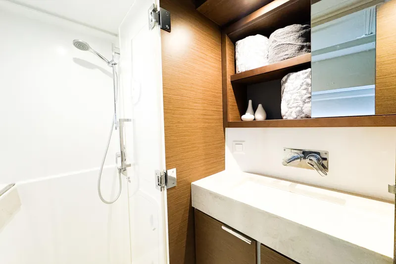 Slide: The Image of Modern bathroom in 2018 Lagoon 40 yacht with shower and wooden cabinetry. - 40