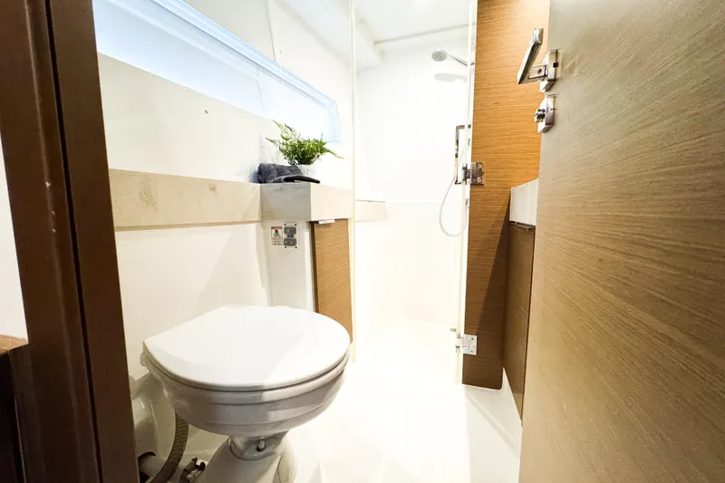 Slide: The Image of Modern bathroom interior on 2018 Lagoon 40 yacht, featuring shower and toilet. - 41